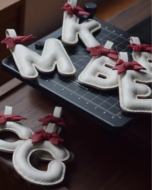 A festive letter bag charm handcrafted from French goatskin leather. Choose from 26 letters and create custom combinations, hand-stitched and gift boxed.