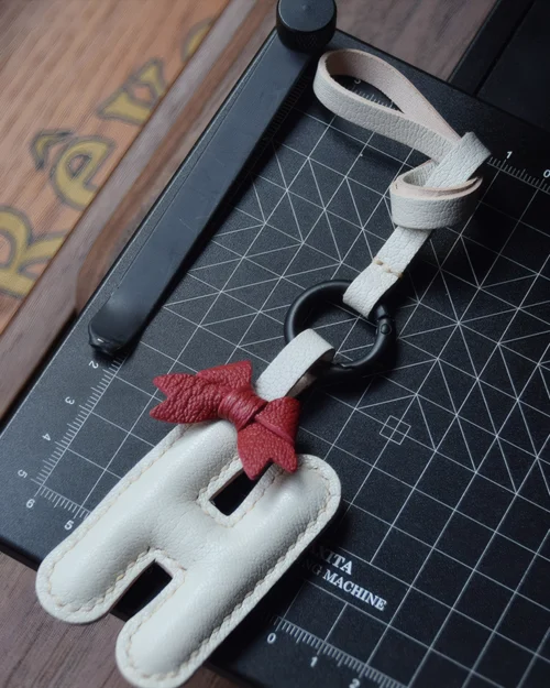 A festive letter bag charm handcrafted from French goatskin leather. Choose from 26 letters and create custom combinations, hand-stitched and gift boxed.