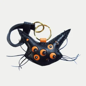 Cat bag charm handcrafted from French goatskin leather, hand-stitched over three days and gift boxed for bags, keys, or car key accessories.
