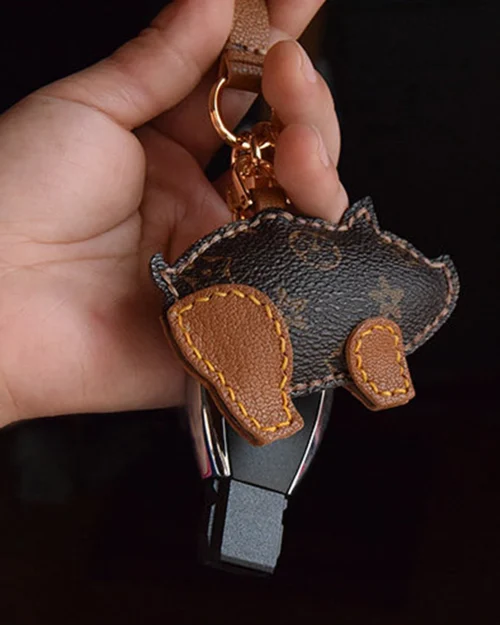 Wild boar bag charm handcrafted from premium leather, hand-stitched over three days and gift boxed for bags, keys, or car key accessories.