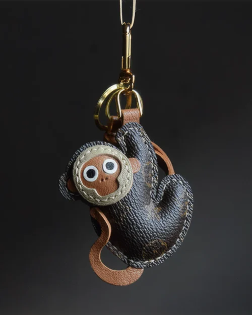 Monkey bag charm handcrafted from premium leather, fully hand-stitched over three days and gift boxed for bags, keys, or car accessories.