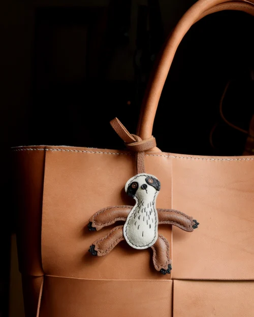 Sloth Bag Charm handcrafted from French goatskin leather, hand-stitched over three days and gift boxed for bags, keys, and car key accessories.