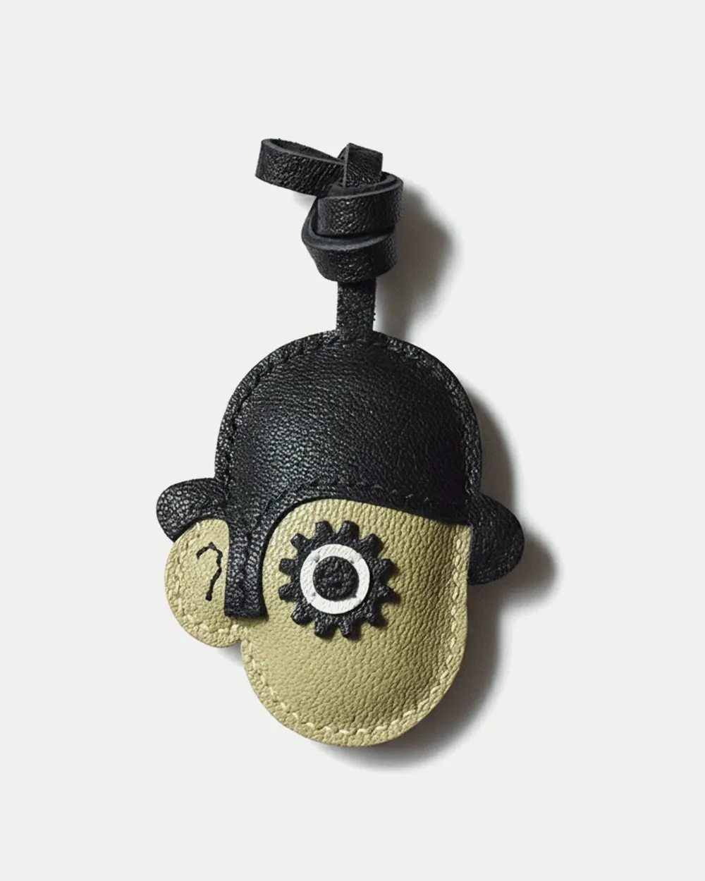 Clockwork Character bag charm handcrafted from premium leather. Hand-stitched over three days and gift boxed for bags, keys, or car keys.