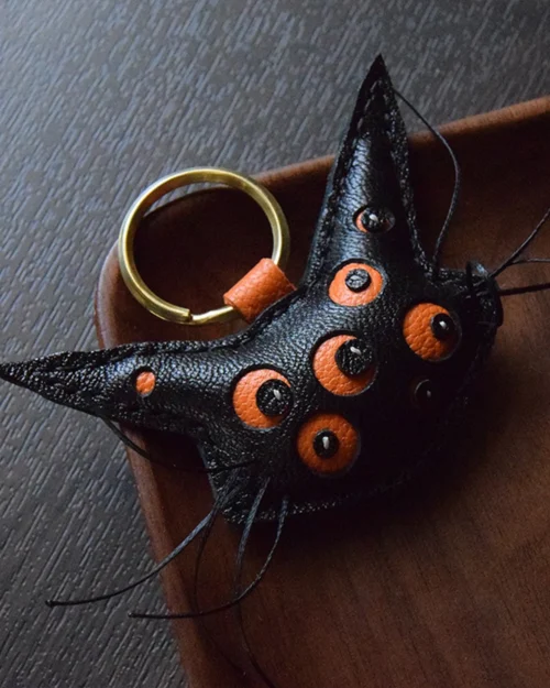 Cat bag charm handcrafted from French goatskin leather, hand-stitched over three days and gift boxed for bags, keys, or car key accessories.