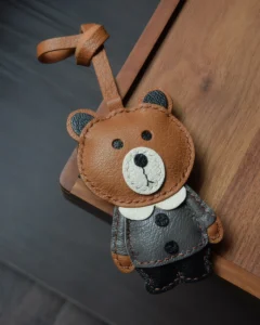 Bear Bag Charm handcrafted from French goatskin leather, hand-stitched over three days and gift boxed for bags, keys, and car key accessories.