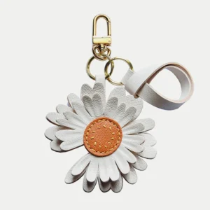 Daisy flower bag charm handcrafted from premium leather, hand-stitched over three days and gift boxed for bags, keys, or car key accessories.