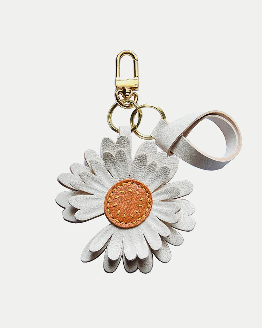 Daisy flower bag charm handcrafted from premium leather, hand-stitched over three days and gift boxed for bags, keys, or car key accessories.