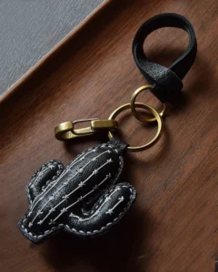 Cactus bag charm handcrafted from French goatskin leather, hand-stitched over three days and gift boxed for bags, keys, or car key accessories.