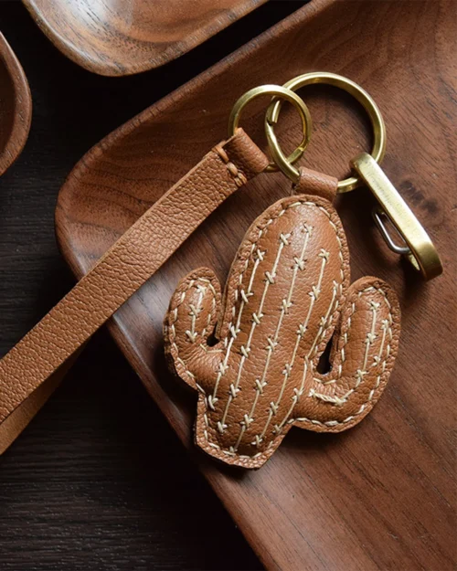 Cactus bag charm handcrafted from French goatskin leather, hand-stitched over three days and gift boxed for bags, keys, or car key accessories.