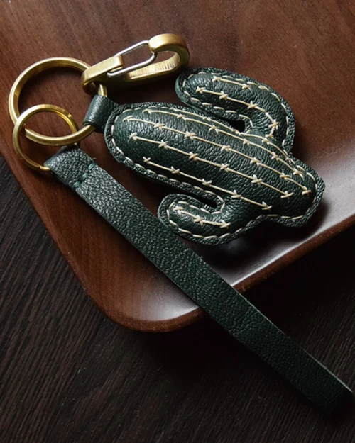 Cactus bag charm handcrafted from French goatskin leather, hand-stitched over three days and gift boxed for bags, keys, or car key accessories.