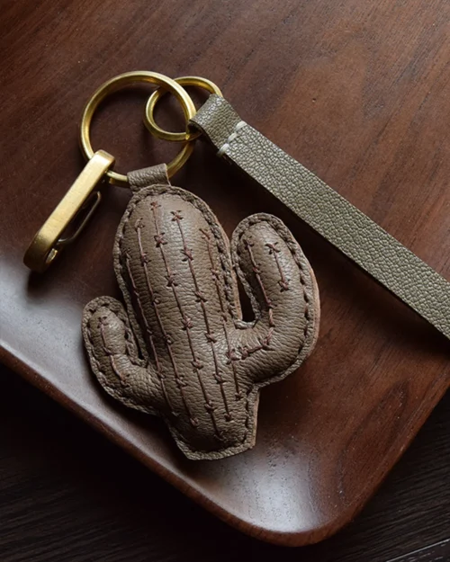 Cactus bag charm handcrafted from French goatskin leather, hand-stitched over three days and gift boxed for bags, keys, or car key accessories.