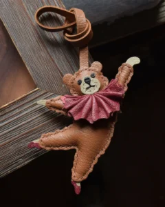 trendy cartoon bag charm,cartoon leather keychain,handmade cartoon leather charm,cartoon bag accessory,car key accessory leather,abstract cartoon charm,ballet style bag charm,handcrafted leather accessory,designer bag charm,leather keychain cartoon