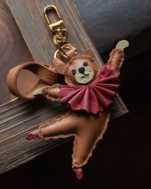 trendy cartoon bag charm,cartoon leather keychain,handmade cartoon leather charm,cartoon bag accessory,car key accessory leather,abstract cartoon charm,ballet style bag charm,handcrafted leather accessory,designer bag charm,leather keychain cartoon