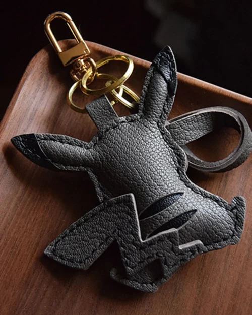Electric mouse bag charm handcrafted from premium leather, hand-stitched over three days and gift boxed for bags, keys, or car key accessories.