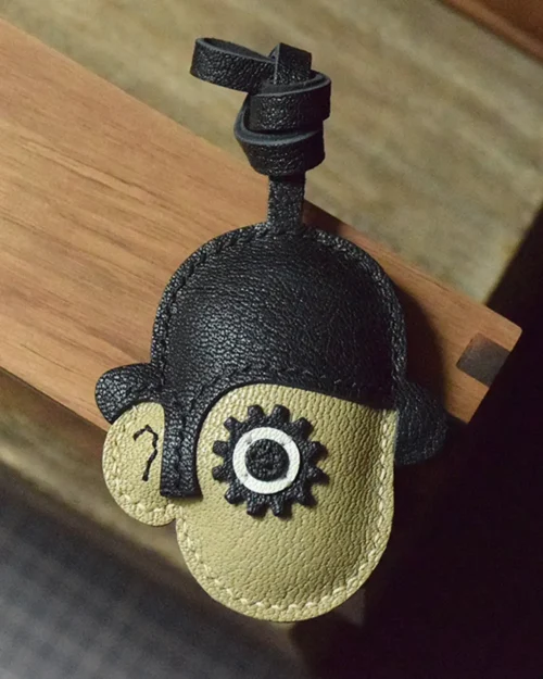 Clockwork Character bag charm handcrafted from premium leather. Hand-stitched over three days and gift boxed for bags, keys, or car keys.