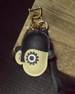 Clockwork Character bag charm handcrafted from premium leather. Hand-stitched over three days and gift boxed for bags, keys, or car keys.
