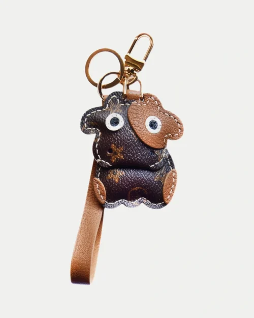 Cow Bag Charm handcrafted from French goatskin leather, hand-stitched over three days and gift boxed for bags, keys, and car key accessories.