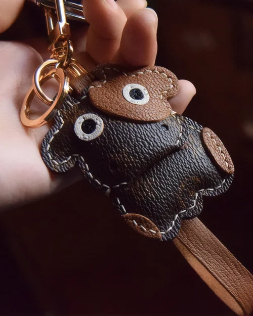 Cow Bag Charm handcrafted from French goatskin leather, hand-stitched over three days and gift boxed for bags, keys, and car key accessories.