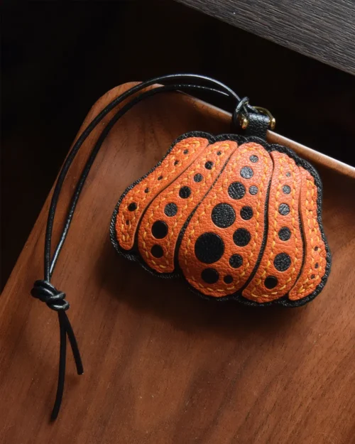 Pumpkin Bag Charm handcrafted from French goatskin leather, hand-stitched over three days and gift boxed for bags, keys, and car key accessories.