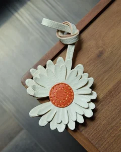 Daisy flower bag charm handcrafted from premium leather, hand-stitched over three days and gift boxed for bags, keys, or car key accessories.