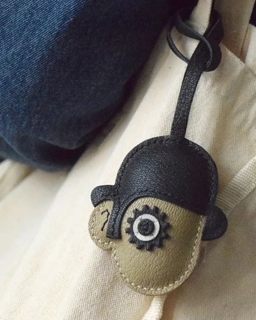 Clockwork Character bag charm handcrafted from premium leather. Hand-stitched over three days and gift boxed for bags, keys, or car keys.