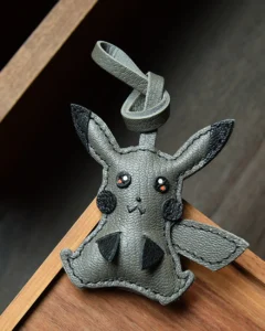 Electric mouse bag charm handcrafted from premium leather, hand-stitched over three days and gift boxed for bags, keys, or car key accessories.