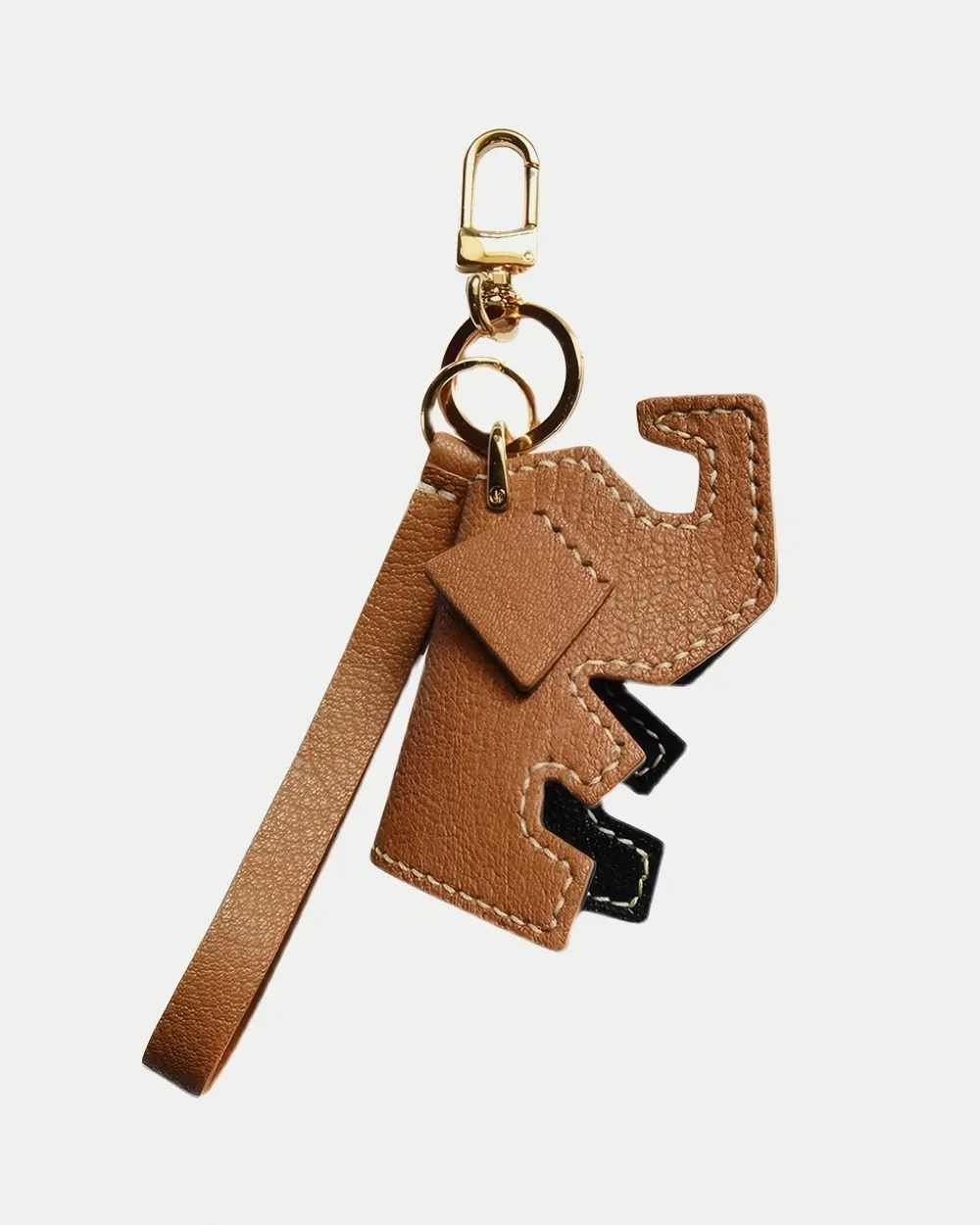 Elephant Bag Charm handcrafted from French goatskin leather, hand-stitched over three days and gift boxed for bags, keys, and car key accessories.