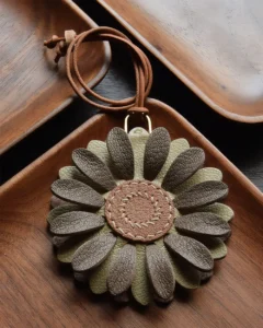 Flower Bag Charm handcrafted from French goatskin leather, hand-stitched over three days and gift boxed for bags, keys, and car key accessories.