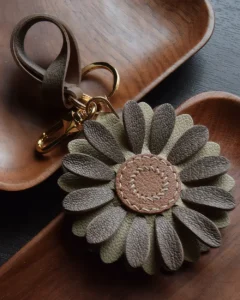 Flower Bag Charm handcrafted from French goatskin leather, hand-stitched over three days and gift boxed for bags, keys, and car key accessories.