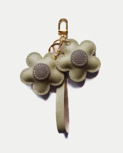 Flower Bag Charm handcrafted from French goatskin leather, hand-stitched over three days and gift boxed for bags, keys, and car key accessories.