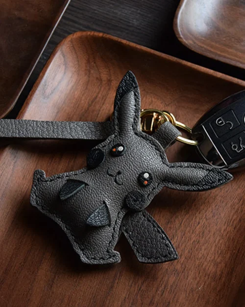 Electric mouse bag charm handcrafted from premium leather, hand-stitched over three days and gift boxed for bags, keys, or car key accessories.