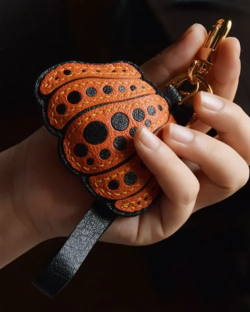 Pumpkin Bag Charm handcrafted from French goatskin leather, hand-stitched over three days and gift boxed for bags, keys, and car key accessories.