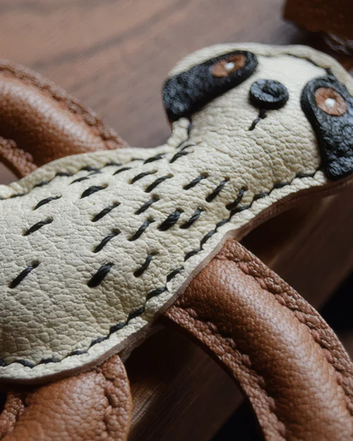 Sloth Bag Charm handcrafted from French goatskin leather, hand-stitched over three days and gift boxed for bags, keys, and car key accessories.