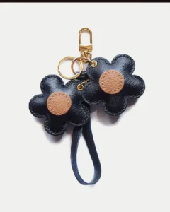 Flower Bag Charm handcrafted from French goatskin leather, hand-stitched over three days and gift boxed for bags, keys, and car key accessories.