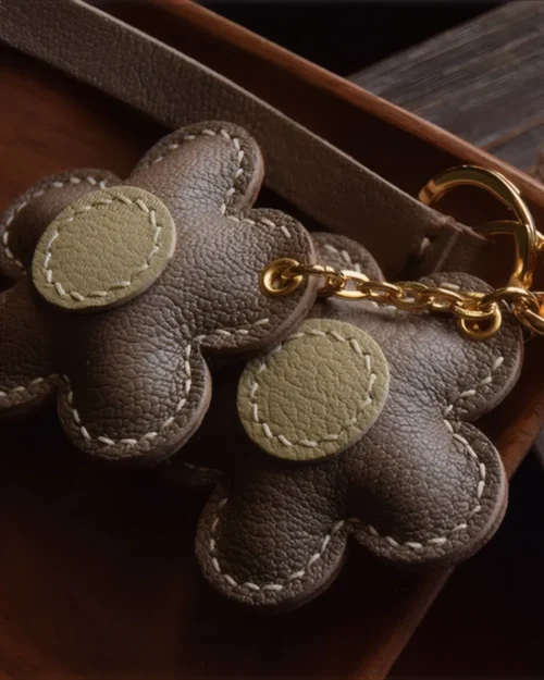 Flower Bag Charm handcrafted from French goatskin leather, hand-stitched over three days and gift boxed for bags, keys, and car key accessories.