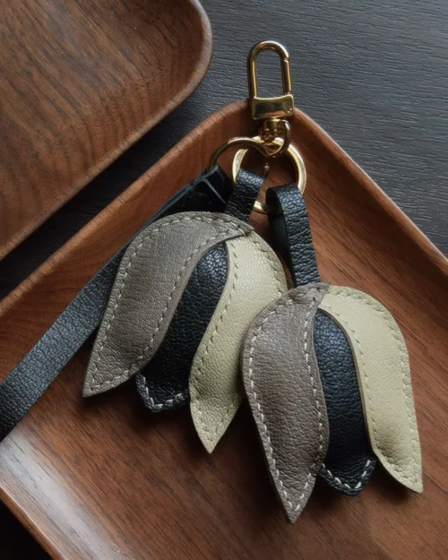 Tulip Bag Charm handcrafted from French goatskin leather, hand-stitched over three days and gift boxed for bags, keys, and car key accessories.