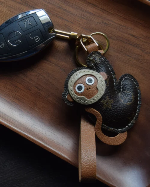 Monkey bag charm handcrafted from premium leather, fully hand-stitched over three days and gift boxed for bags, keys, or car accessories.