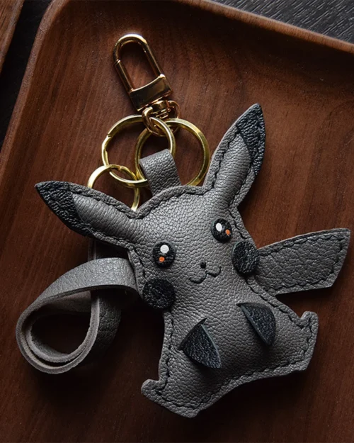 Electric mouse bag charm handcrafted from premium leather, hand-stitched over three days and gift boxed for bags, keys, or car key accessories.