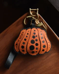 Pumpkin Bag Charm handcrafted from French goatskin leather, hand-stitched over three days and gift boxed for bags, keys, and car key accessories.