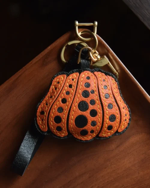 Pumpkin Bag Charm handcrafted from French goatskin leather, hand-stitched over three days and gift boxed for bags, keys, and car key accessories.