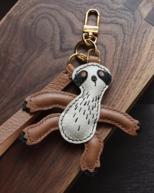 Sloth Bag Charm handcrafted from French goatskin leather, hand-stitched over three days and gift boxed for bags, keys, and car key accessories.