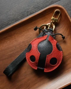 Ladybug Bag Charm handcrafted from French goatskin leather, hand-stitched over three days and gift boxed for bags, keys, and car key accessories.