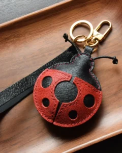 Ladybug Bag Charm handcrafted from French goatskin leather, hand-stitched over three days and gift boxed for bags, keys, and car key accessories.