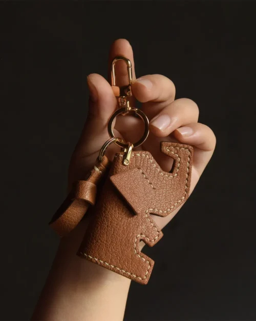 Elephant Bag Charm handcrafted from French goatskin leather, hand-stitched over three days and gift boxed for bags, keys, and car key accessories.