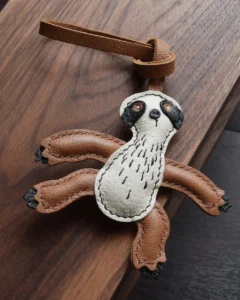 Sloth Bag Charm handcrafted from French goatskin leather, hand-stitched over three days and gift boxed for bags, keys, and car key accessories.