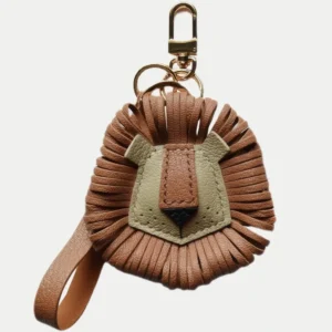 Lion Bag Charm handcrafted from French goatskin leather, hand-stitched over three days and gift boxed for bags, keys, and car key accessories.