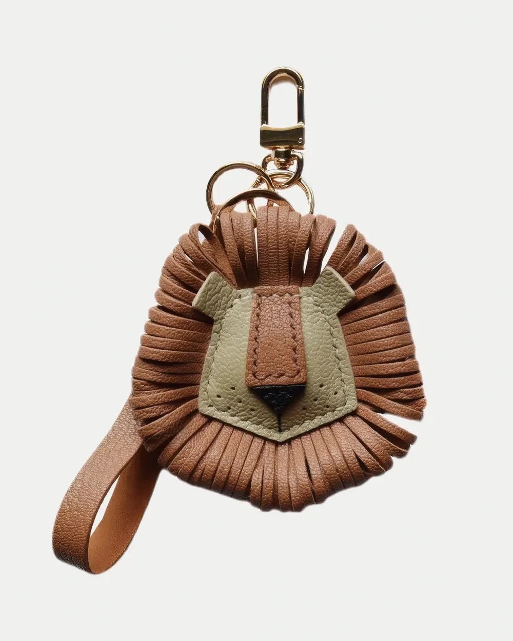 Lion Bag Charm handcrafted from French goatskin leather, hand-stitched over three days and gift boxed for bags, keys, and car key accessories.