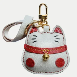 Lucky Cat Bag Charm handcrafted from French goatskin leather, hand-stitched over three days and gift boxed for bags, keys, and car key accessories.