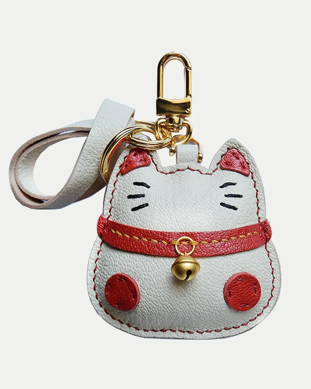 Lucky Cat Bag Charm handcrafted from French goatskin leather, hand-stitched over three days and gift boxed for bags, keys, and car key accessories.