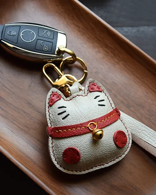 Lucky Cat Bag Charm handcrafted from French goatskin leather, hand-stitched over three days and gift boxed for bags, keys, and car key accessories.